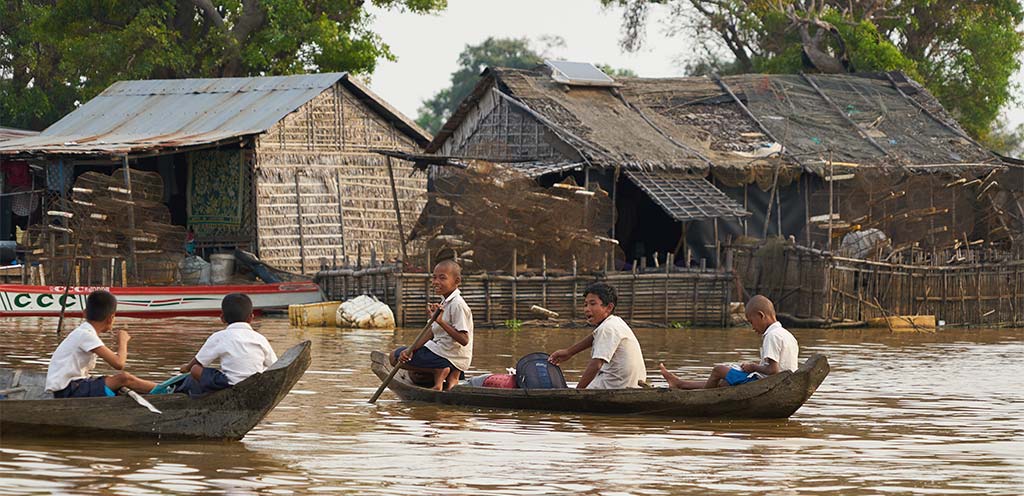 In the Mechrey Floating Village located in Siem Reap Province, children embark on their daily journey to school aboard boats, immersing themselves in a unique way of life.