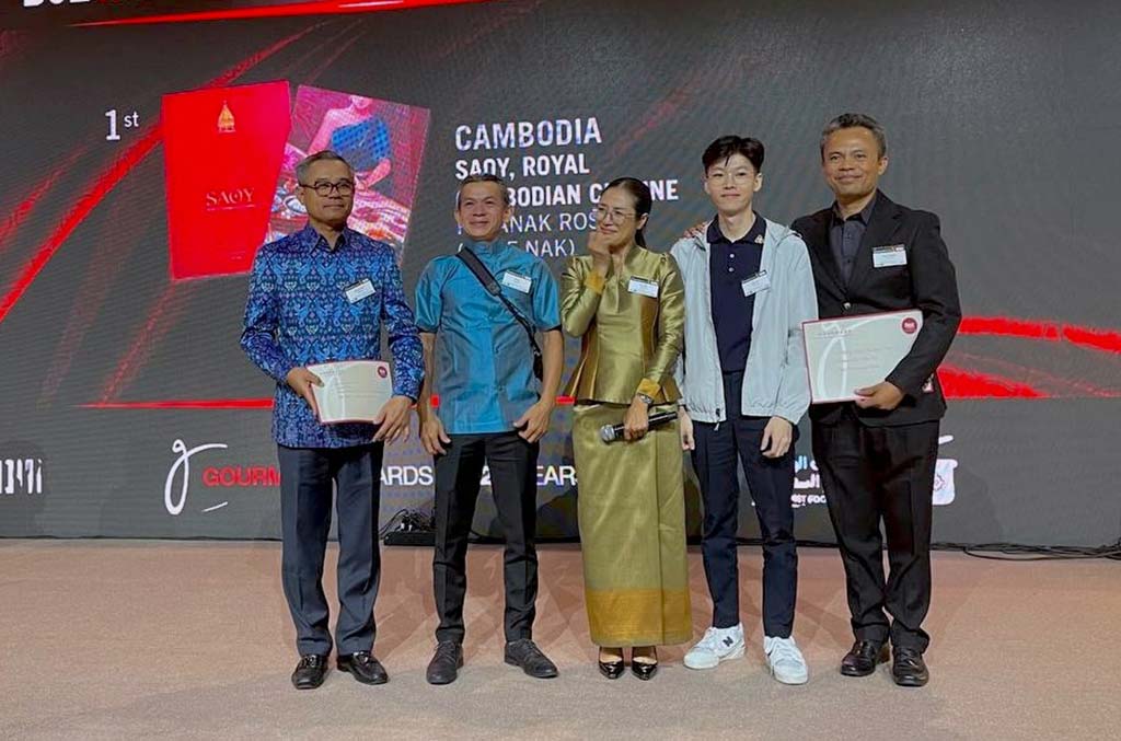 Chef Nak's Cookbook Awards "SAOY: Royal Cambodian Cuisine" involved a team of individuals, including Mr. La Mo, an artist and photographer, and Serey Sot, the book's designer and illustrator.